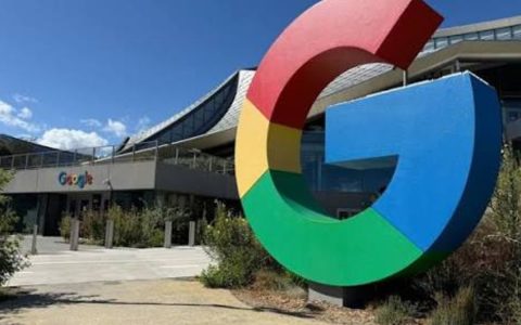 Large Google "G" logo sculpture outside a Google office building