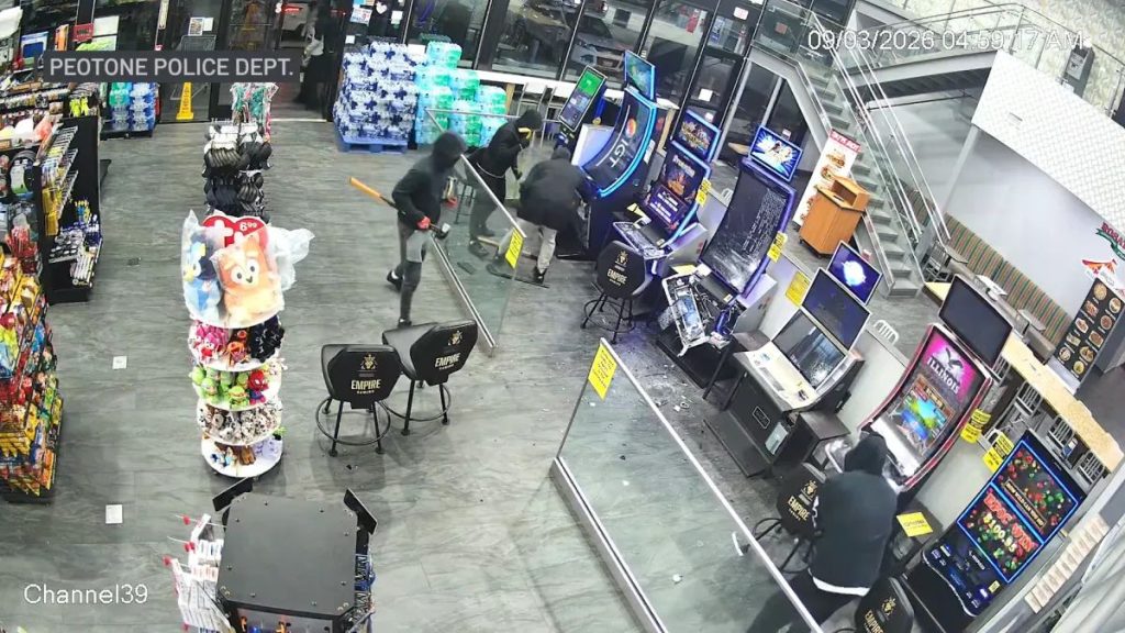 Masked people using hammers to damage video gaming machines at the Peotone Travel Center in Peotone, Illinois, in a Peotone Police Department surveillance image