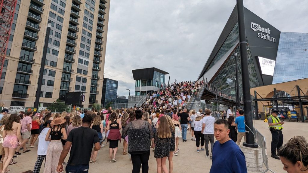 Crowd of fans walking to U.S. Bank Stadium in Minneapolis for a Taylor Swift concert