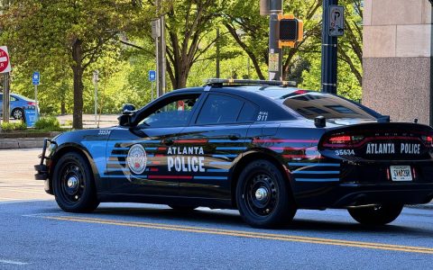 A black Atlanta Police Department patrol car on a city street