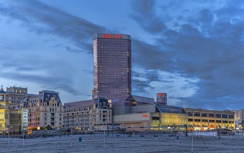 Bally's casino tower and the Boardwalk in Atlantic City, New Jersey, at dusk