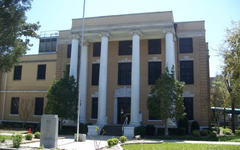 The Bay County Courthouse in Panama City, Florida, a tan brick building with four tall white columns