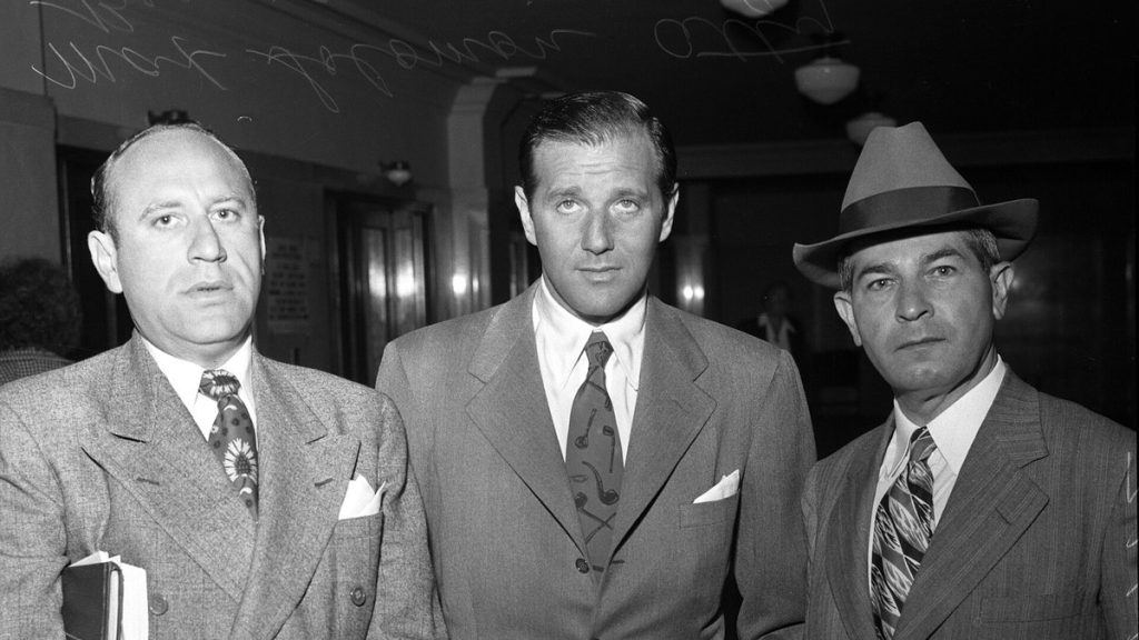 Bugsy Siegel standing between his two attorneys