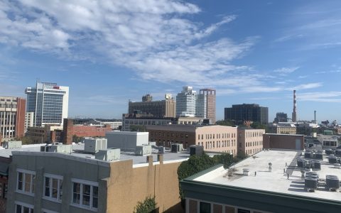 Rooftops and office towers of downtown Bridgeport, Connecticut, under a blue sky