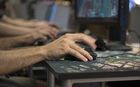 A player uses a keyboard and mouse during an esports tournament