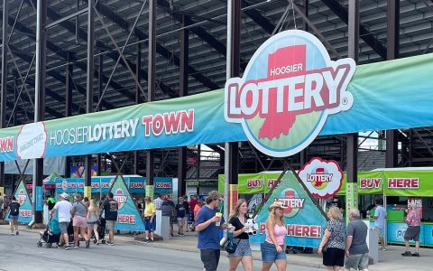 Hoosier Lottery Town booth with a large Hoosier Lottery sign at the Indiana State Fair