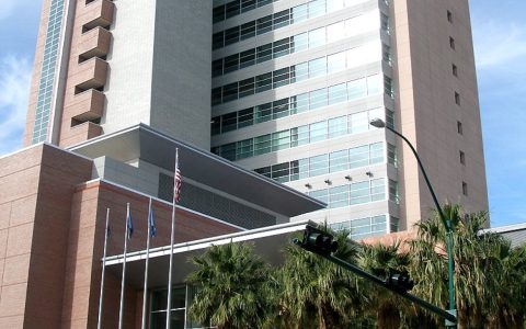 The Regional Justice Center in downtown Las Vegas, a tall courthouse tower with palm trees in front