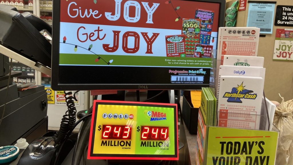 A store lottery counter with Powerball and Mega Millions jackpot displays