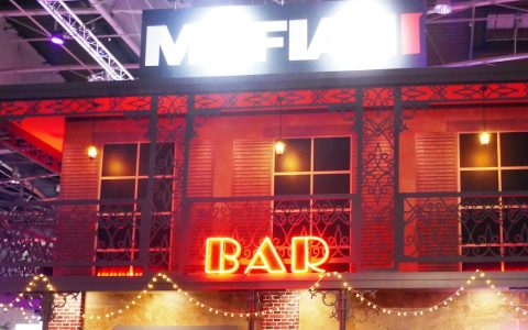 Mafia III stand styled as a New Orleans building with a neon BAR sign at Paris Games Week 2016