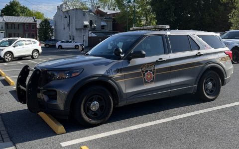 A gray Pennsylvania State Police SUV parked in a lot in Carlisle
