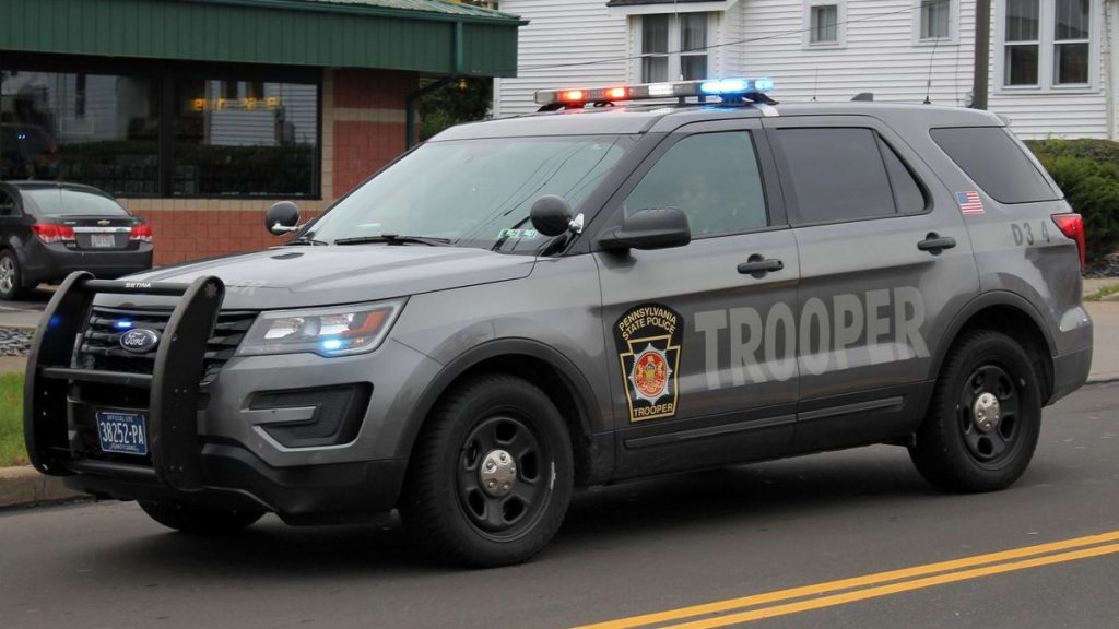 A gray Pennsylvania State Police patrol SUV marked Trooper
