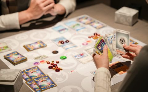 Pokémon trading cards laid out on a play mat during a game