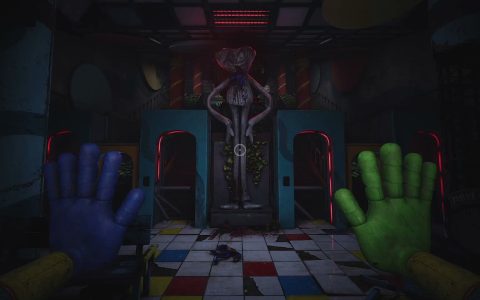 First-person view of blue and green GrabPack hands raised in a dim hall with a checkered floor, two doorways and a tall statue