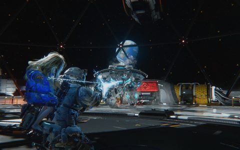 Hugh, carrying Diana, fires at a robot inside a lunar base