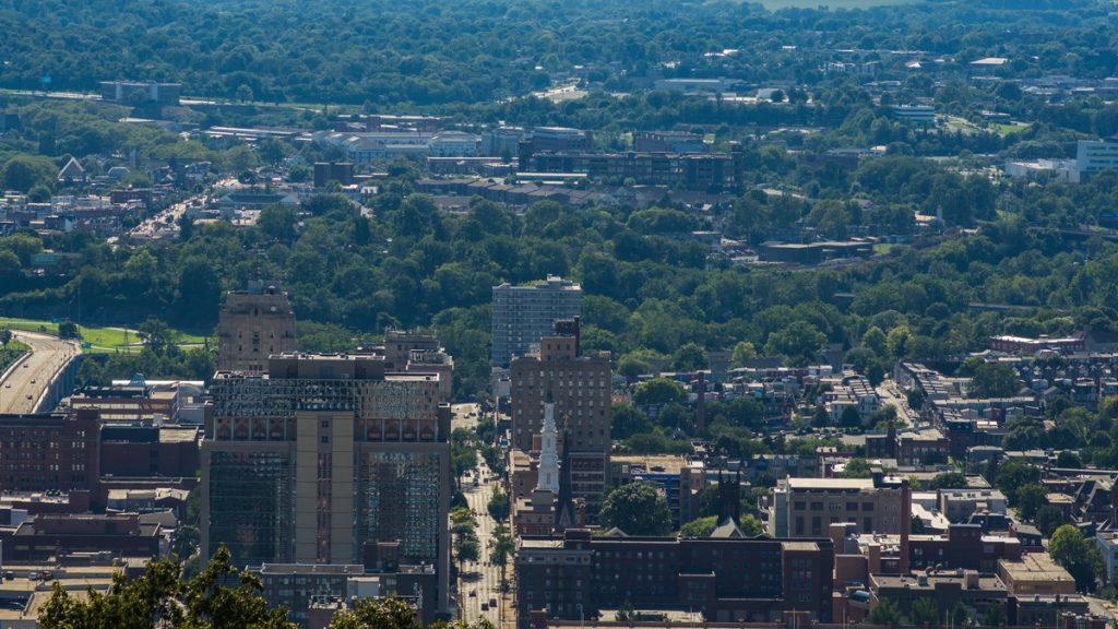 Downtown Reading, Pennsylvania, seen from above with tree-covered hills behind