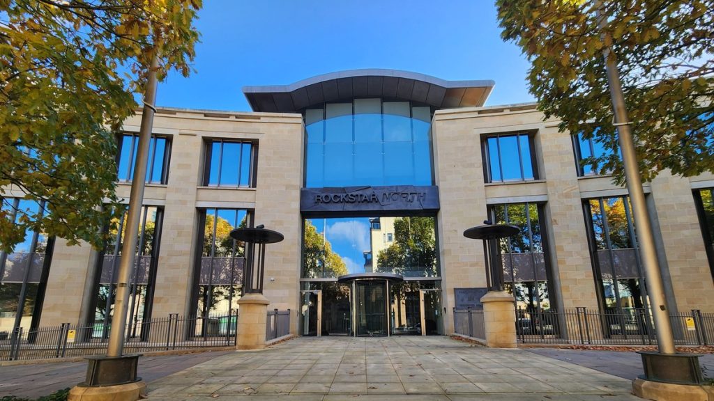 The stone and glass front of Rockstar North headquarters in Edinburgh with the studio name above the entrance