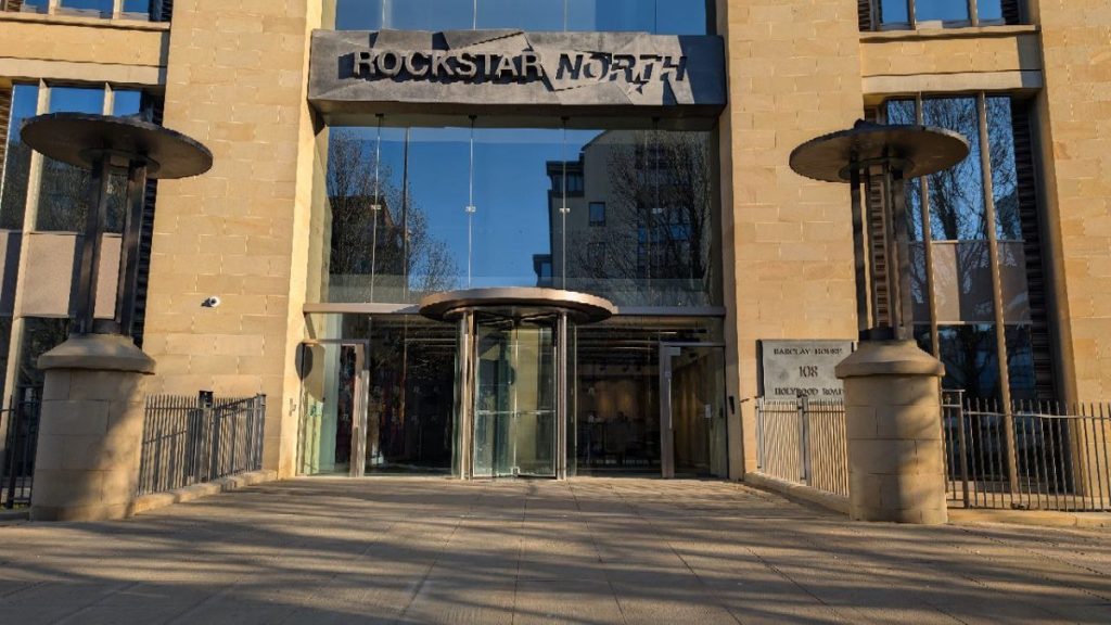 The glass entrance of Rockstar North with the studio name above the door