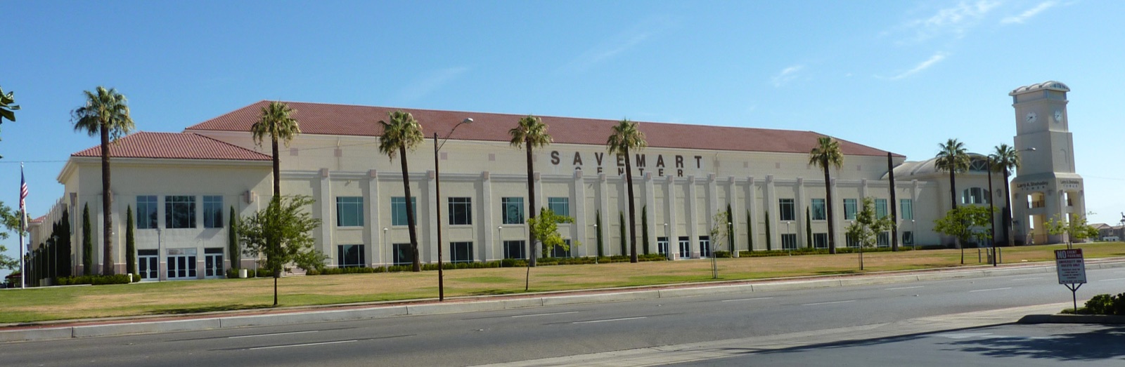 The Save Mart Center arena at Fresno State, a long building with palm trees in front