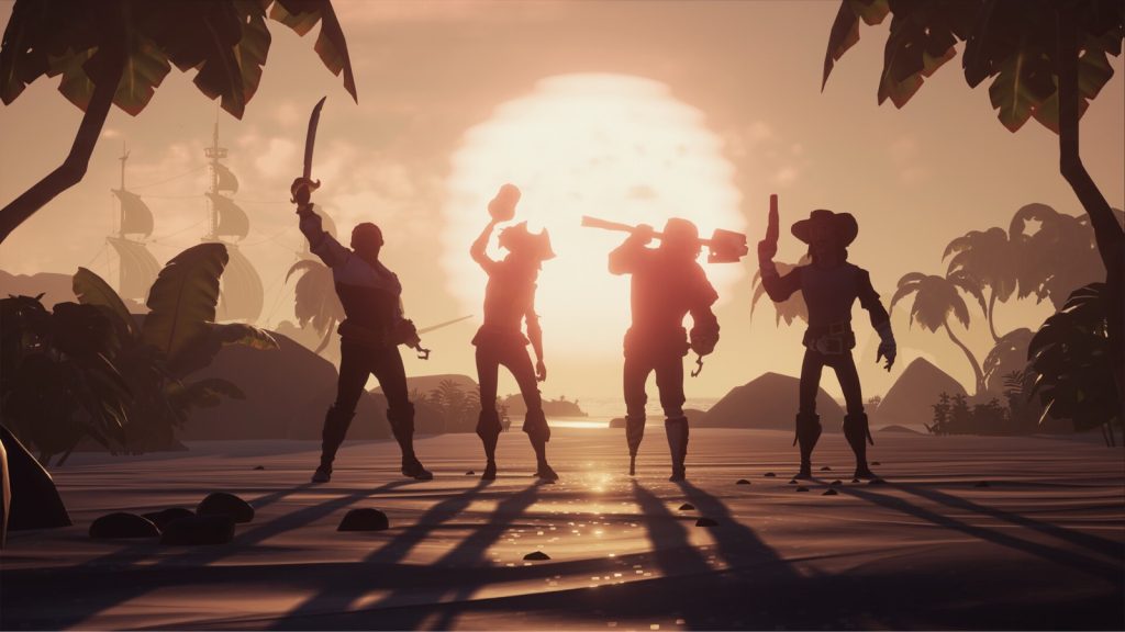 Four pirates raise their weapons in celebration on a beach at sunset