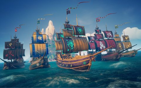A fleet of pirate ships with colorful sails on open sea