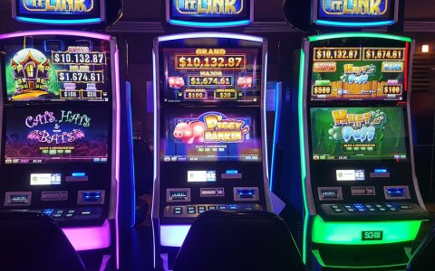 Three lit slot-style gaming machines