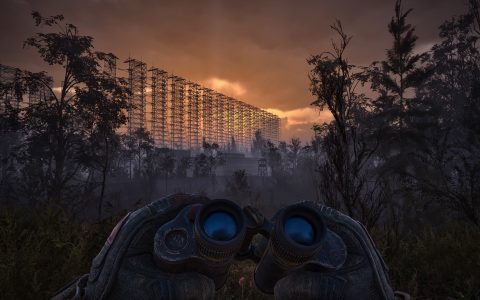 A player holds binoculars facing a huge metal antenna array rising above a forest at sunset