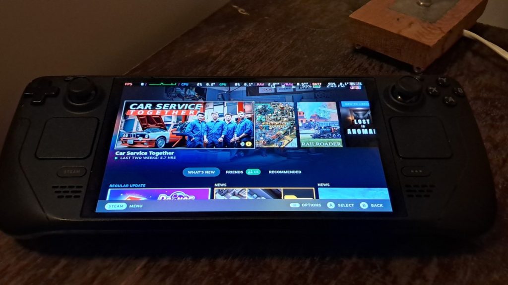 A Valve Steam Deck handheld displaying the Steam home screen