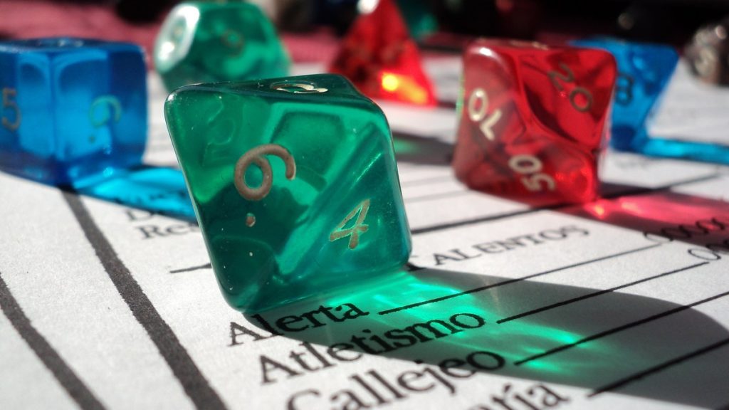 Translucent role-playing dice resting on a printed character sheet