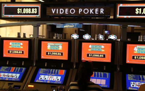 A row of video poker machines in a casino