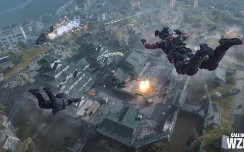 Players skydive over Ashika Island with town buildings and smoke below