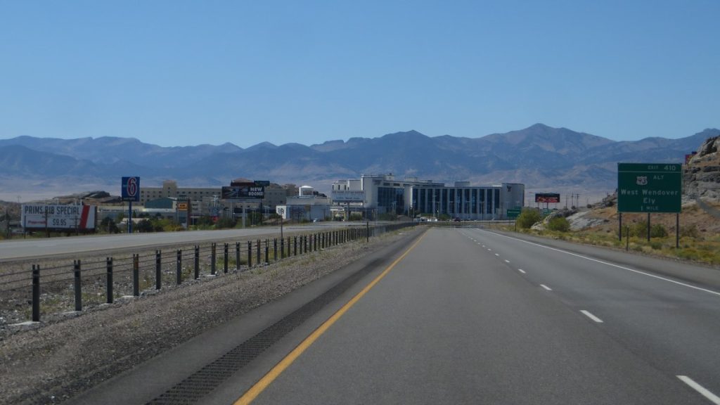 Interstate 80 leading into West Wendover, Nevada, with mountains behind