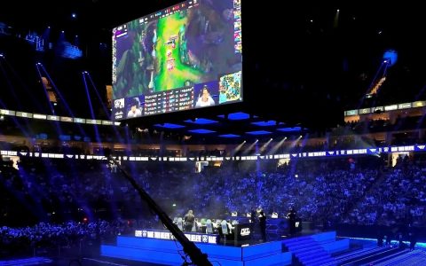T1 and Bilibili Gaming on stage in a packed arena at the 2024 League of Legends World Championship final